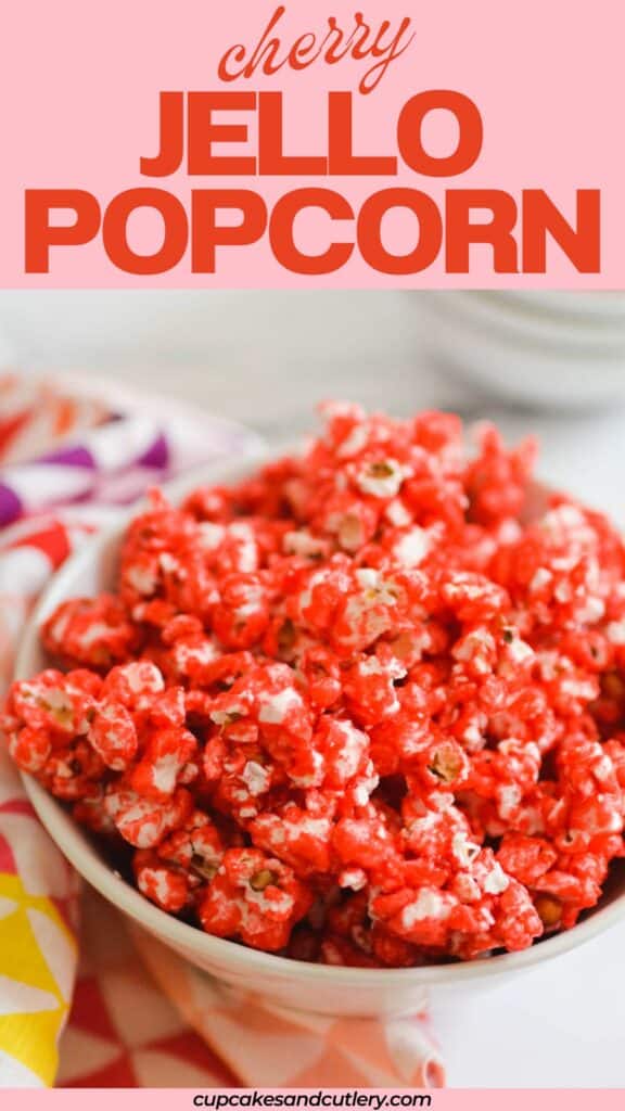 Text: Cherry Jello Popcorn with a white bowl holding pink coated popcorn.