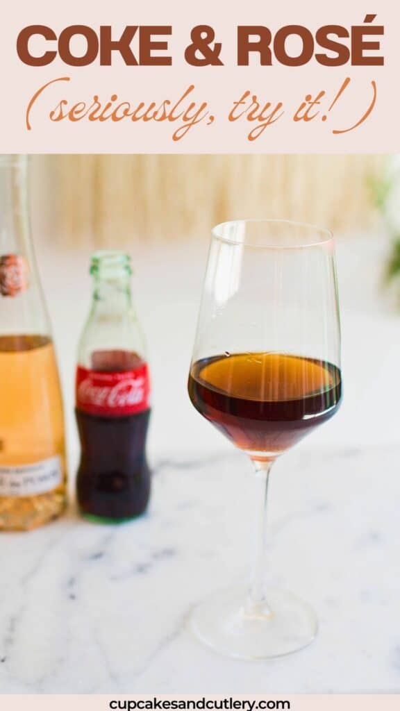Text: Coke and Rose, seriously try it with a wine glass on a table holding a cocktail next to a bottle of rose and one of Coke.