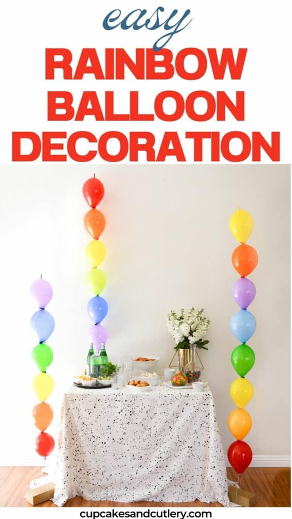 Text: Easy Rainbow Balloon Decoration with 3 simple rainbow balloon columns next to a party table.