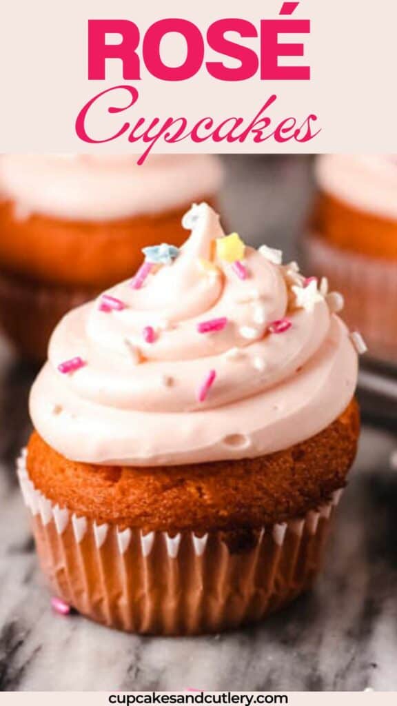 Text: Rose Cupcakes with a pink frosted cupcake on a table topped with sprinkles.