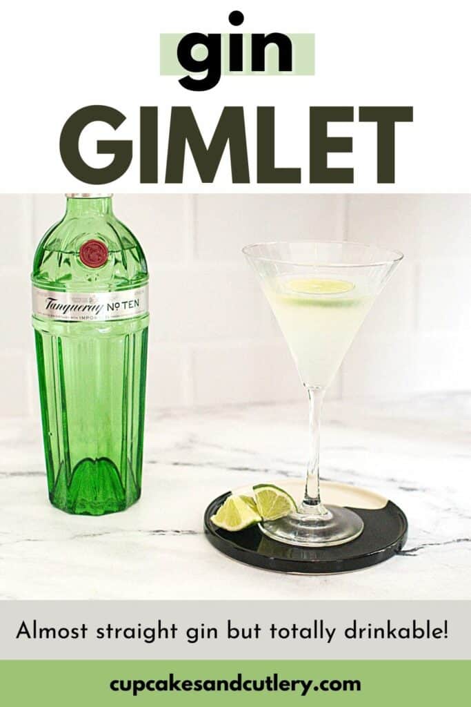 Gin gimlet garnished with fresh lime in a martini glass next to a bottle of gin.