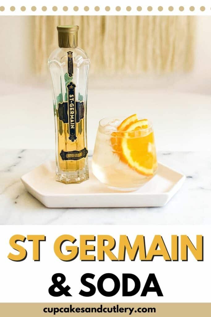 Bottle of St Germain next to a St Germain and Soda garnished with orange slices.