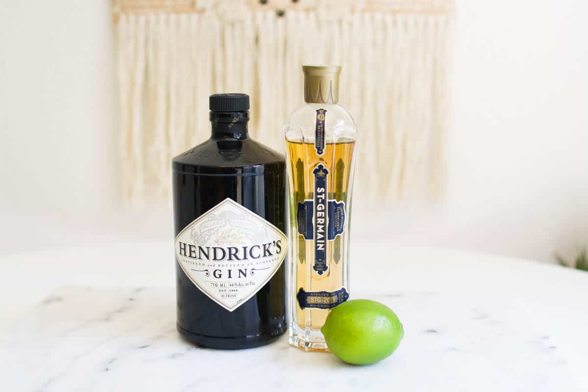 Ingredients to make a St. Germain French Gimlet on a table. 