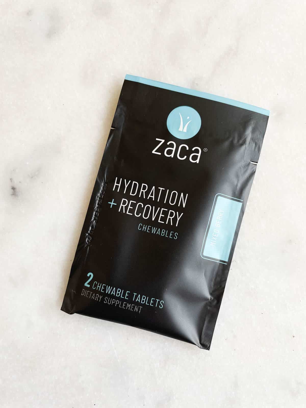 A packet of Zaca chewable tablets for hydration and recovery.