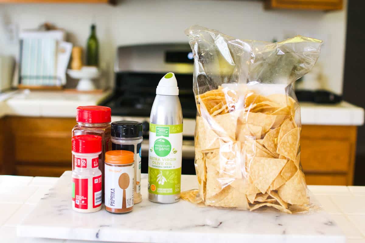 Spices, olive oil and a bag of tortilla chips to jazz up store bought tortilla chips.