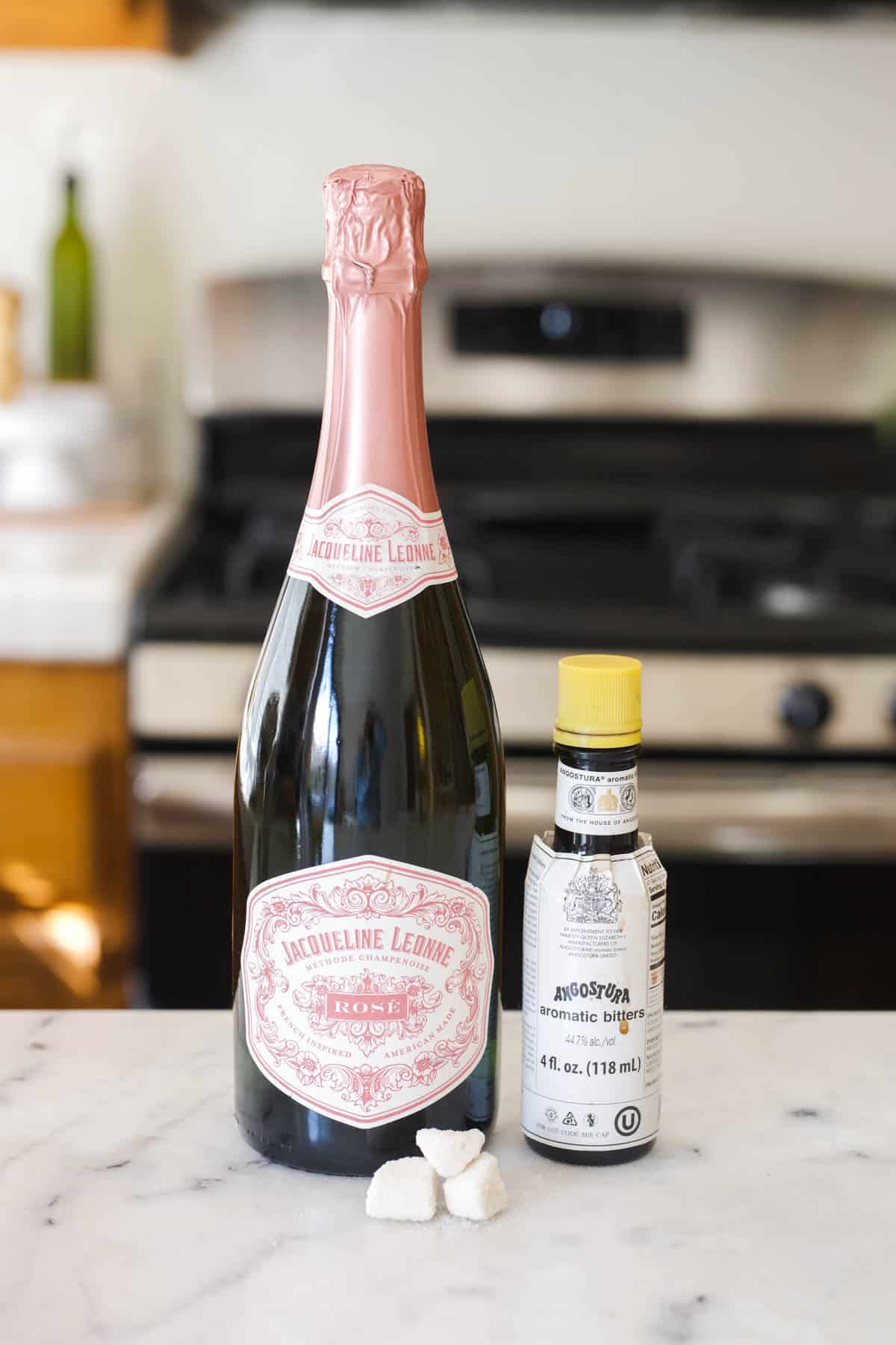 Ingredients for a champagne cocktail on the countertop.