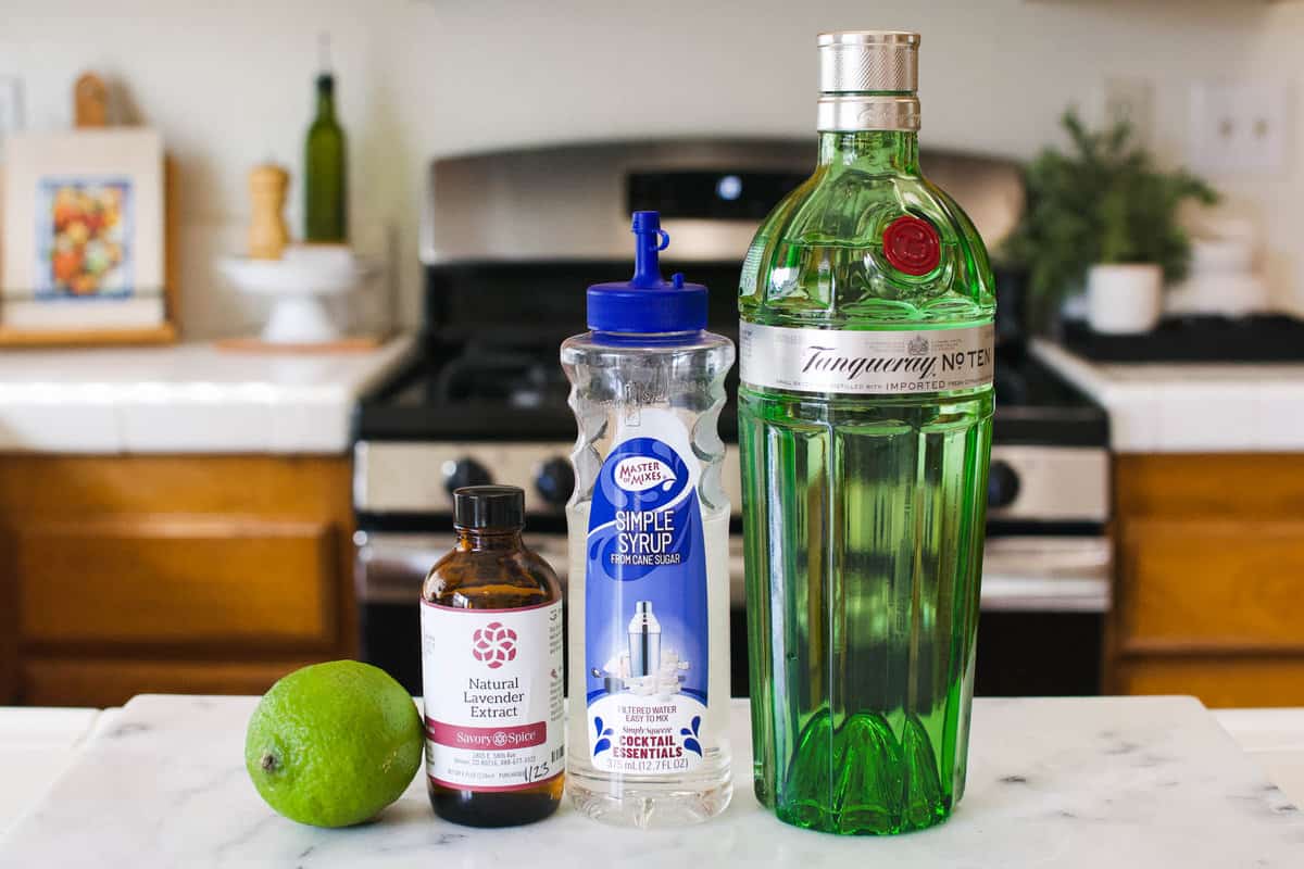 Ingredients to make a Lavender Gimlet on the countertop.