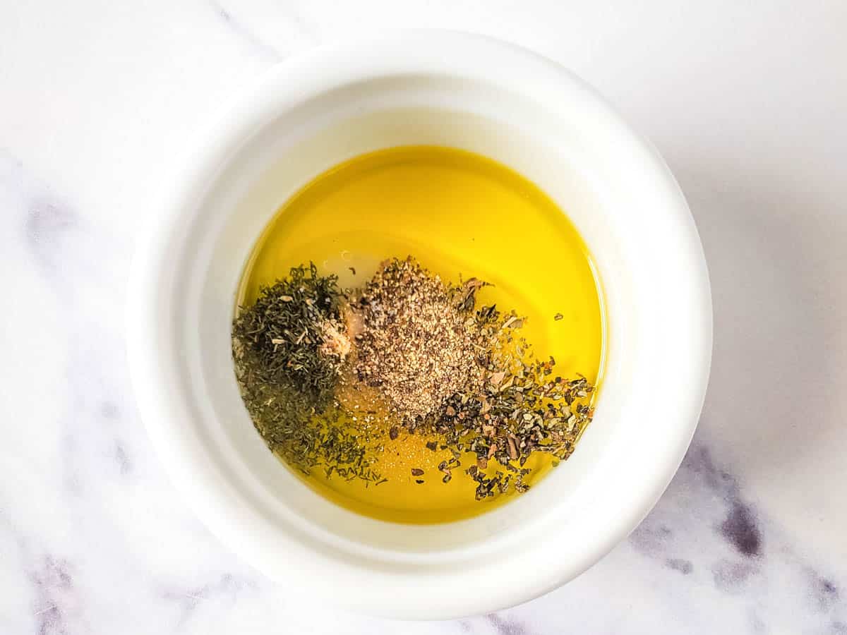 Seasoned olive oil to use as dressing for Mediterranean inspired appetizer.