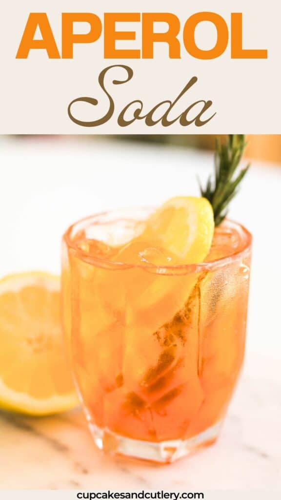 Glass of Aperol soda garnished with rosemary and a fresh lemon wheel.