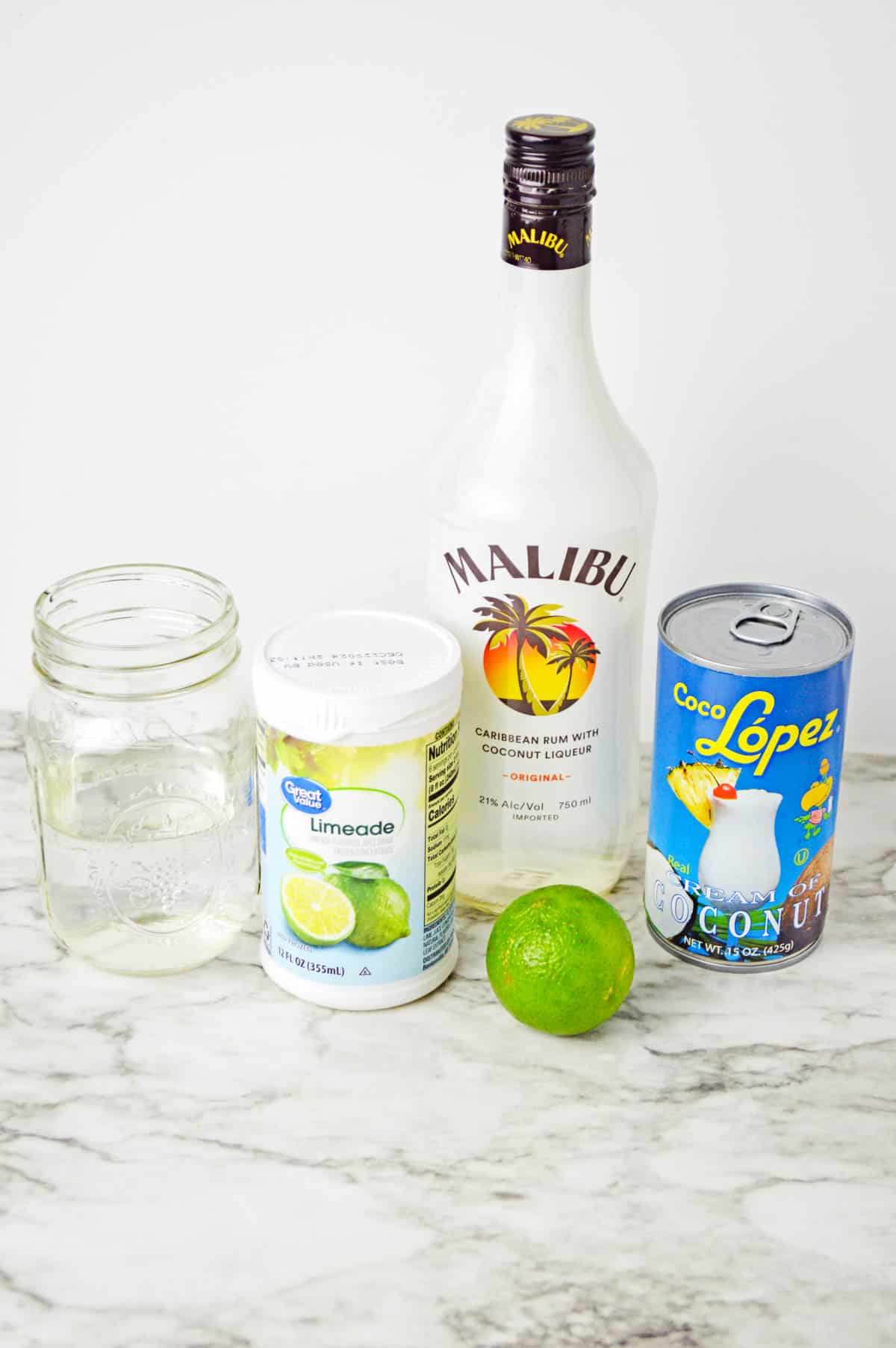 Coconut daiquiri ingredients on a countertop.
