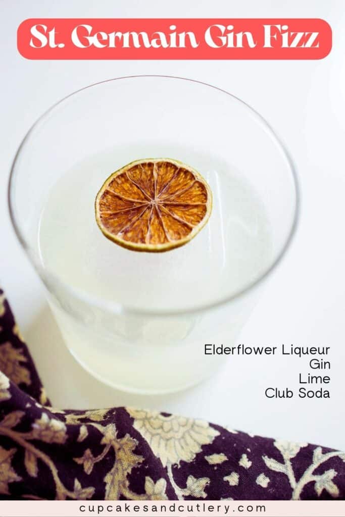 Close up of an Elderflower Gin Cocktail garnished with a dried lime wheel.