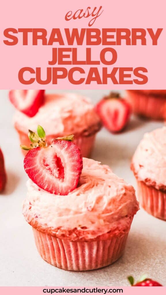 Text: Easy strawberry Jello cupcakes with a pink cupcake, frosted and topped with half a strawberry.