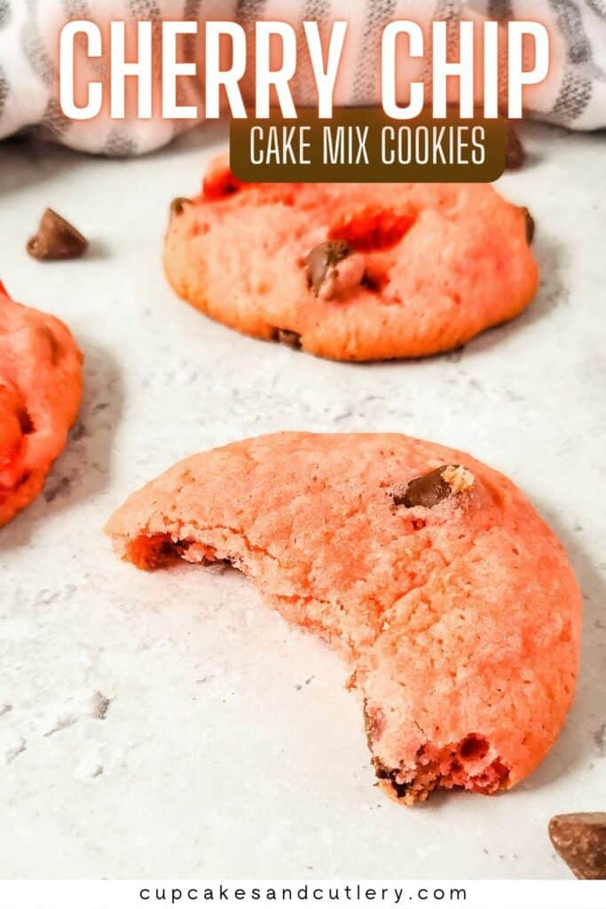 Text: Cherry chip cookies with a few pink cookies with chocolate chips on a table.