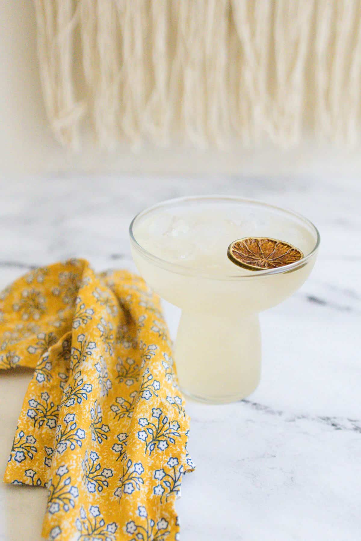 Wine margarita on a marble countertop.