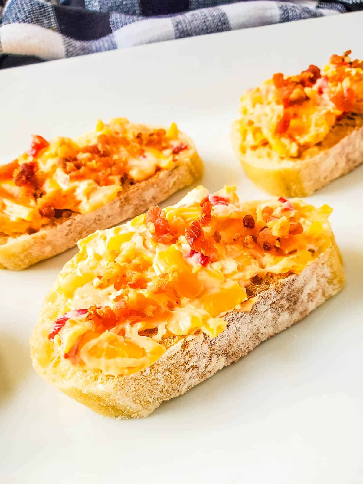 Close up image of bacon pimiento cheese crostini appetizer.