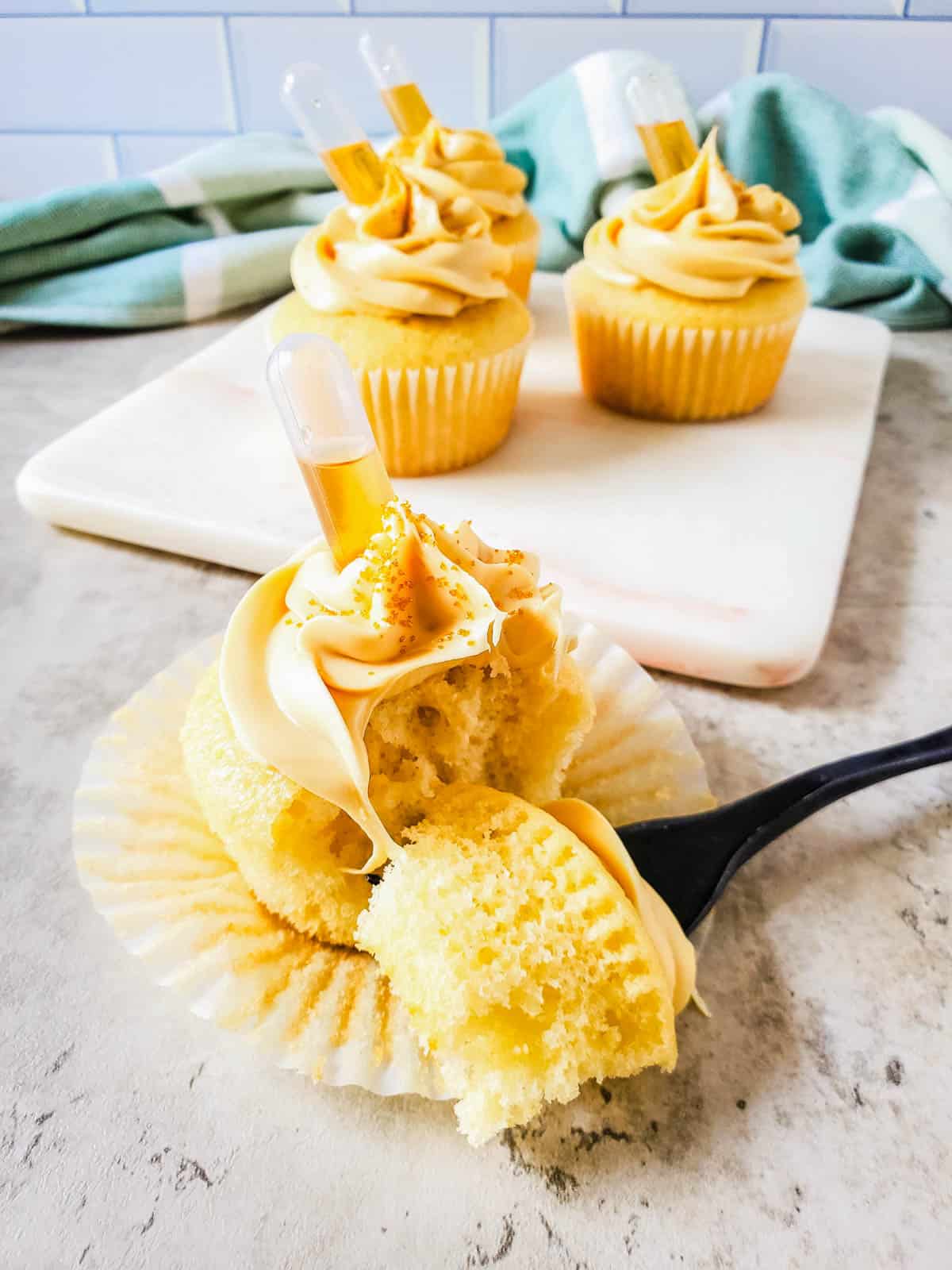 Hennessy cupcakes with salted caramel frosting cut in half.