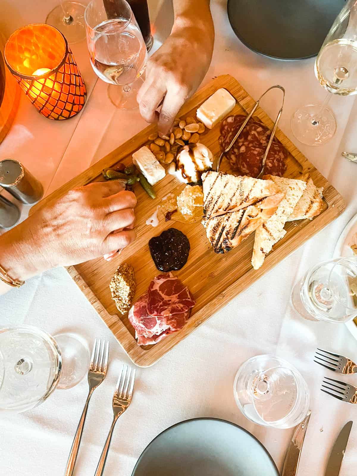 A charcuterie board on the dining table at Tocca Ferro in the JW Marriott Anaheim. 