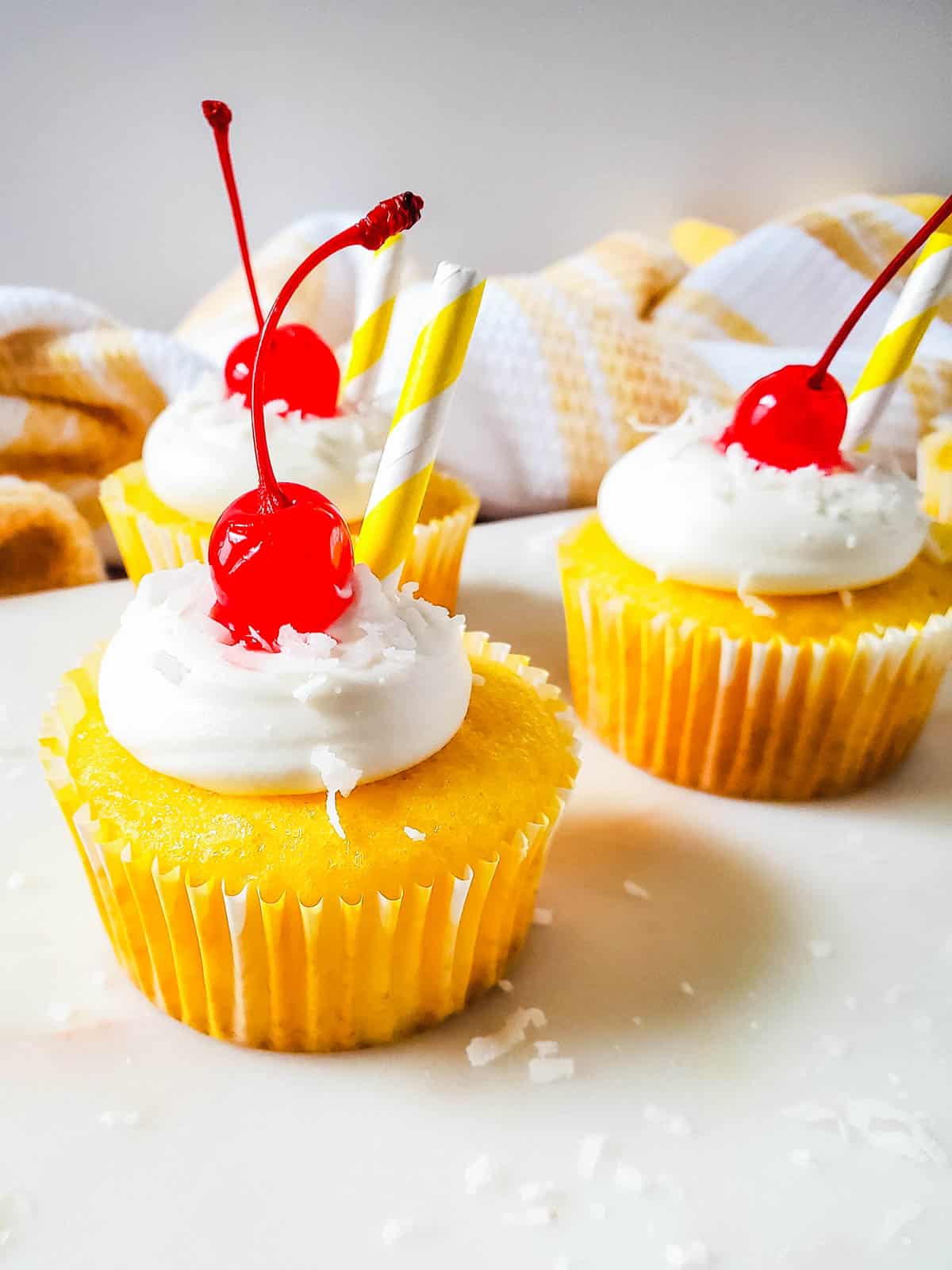 Finished product of this easy boozy pina colada cupcake recipe.