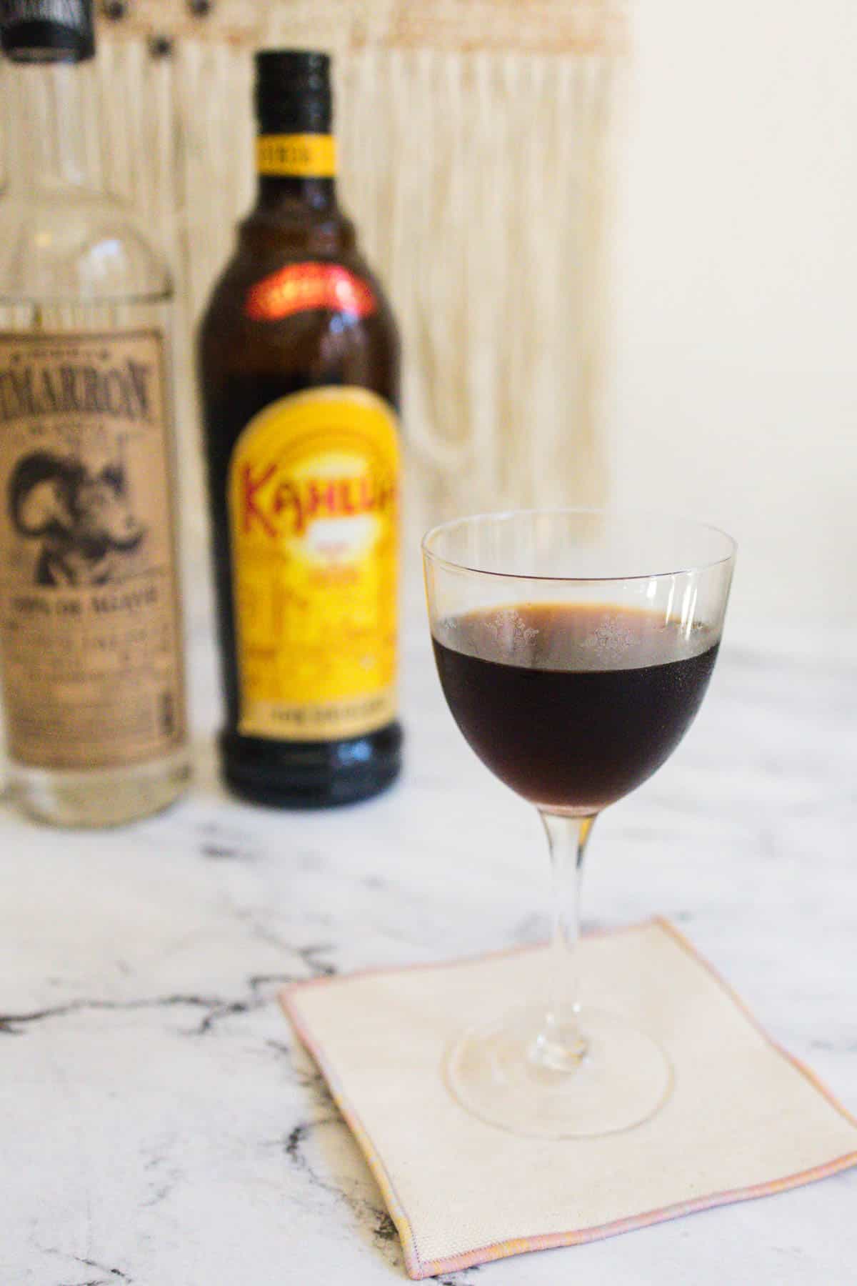 Cold brew martini with the bottles in the background.