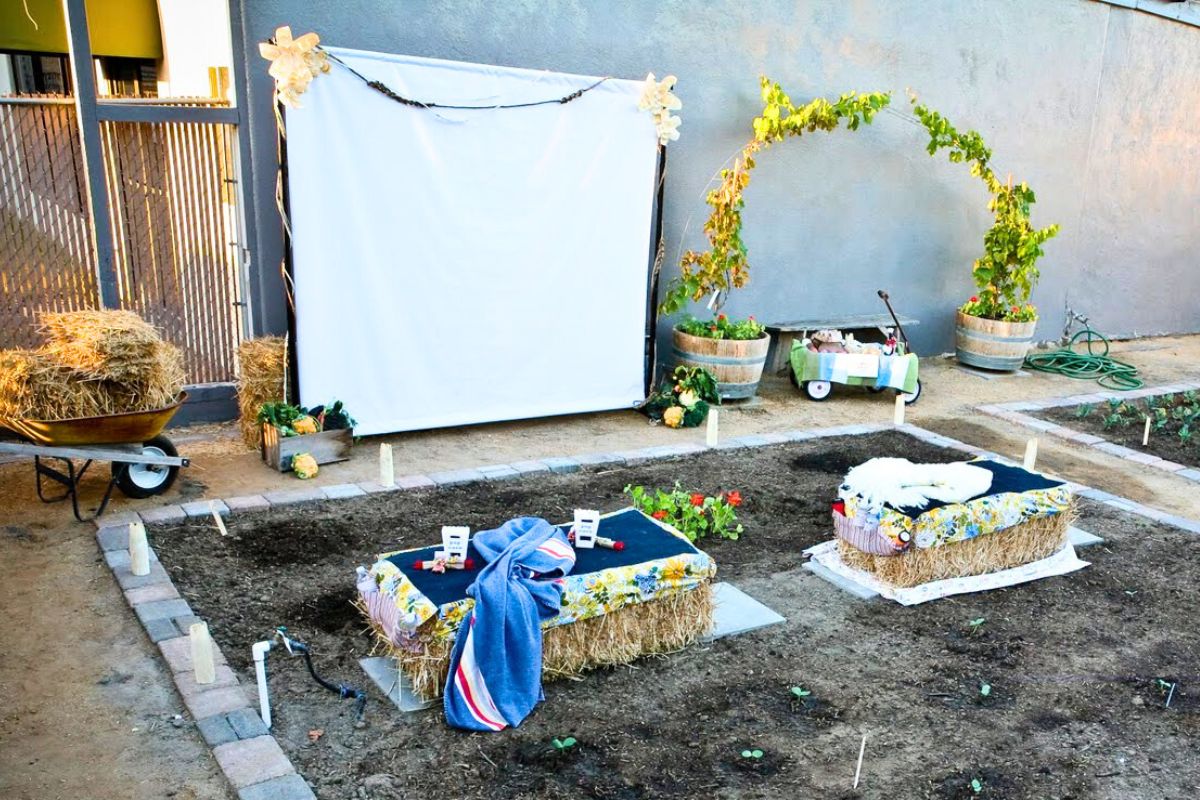 An outdoor movie screen set up for fall movie nights in the backyard.