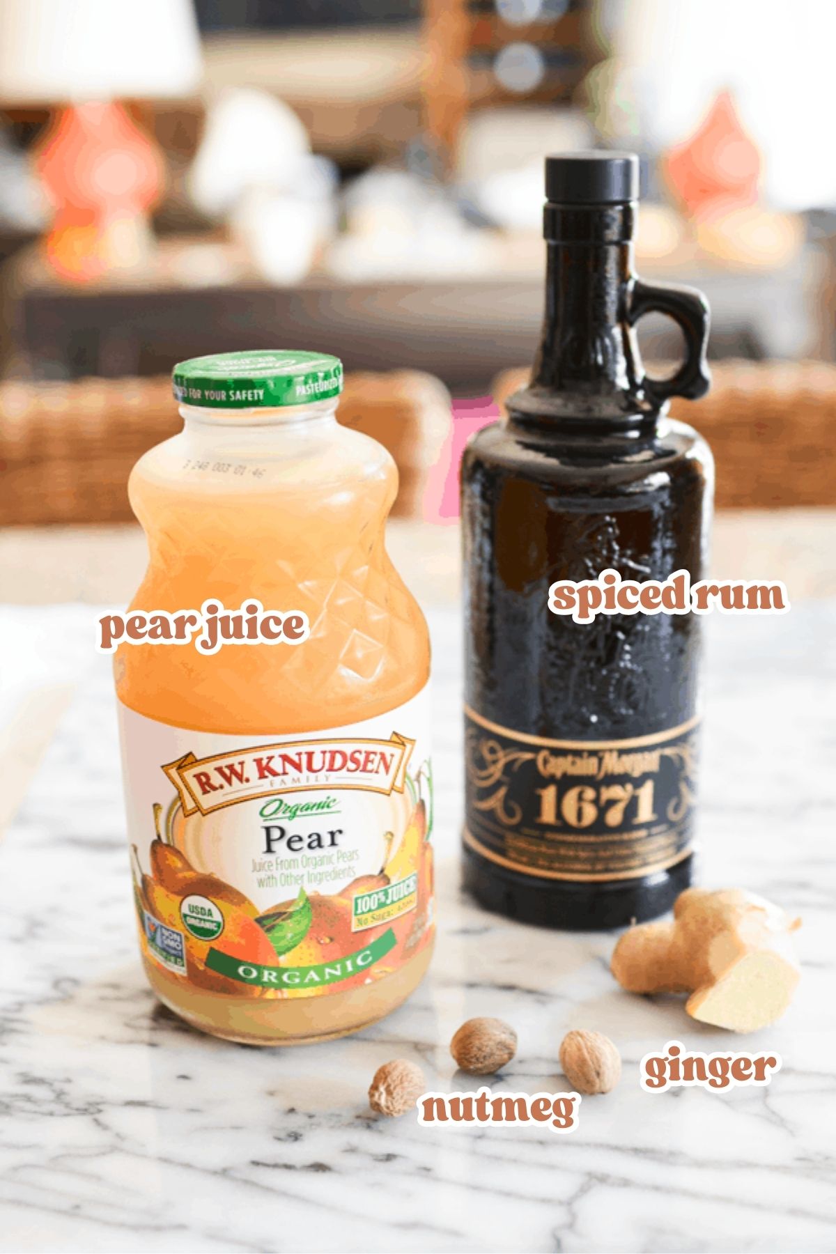 Text: Pear juice, spiced rum, nutmeg and ginger over the ingredient images on a counter.