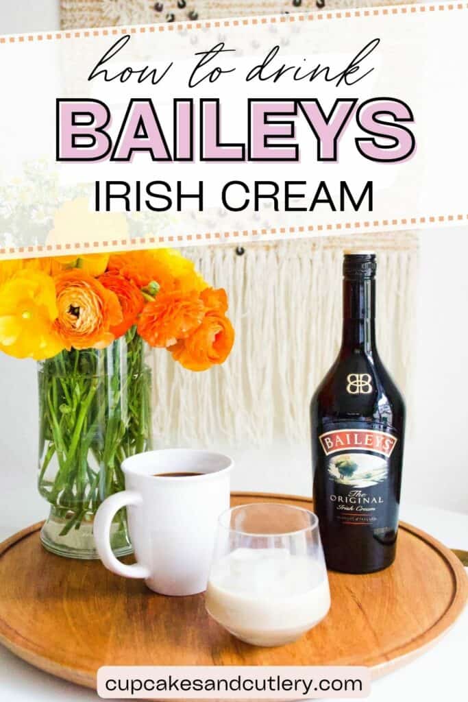 Text: how to drink Baileys Irish Cream with a bottle of Baileys, a cup of coffee, a vase of flowers and a cup with Irish Cream and a large ice cube.