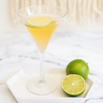 Tequila Martini in a martini glass garnished with a fresh lime wheel.