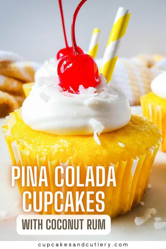 Text: Close up image of pina colada cupcake with vanilla rum frosting and maraschino cherry on top.