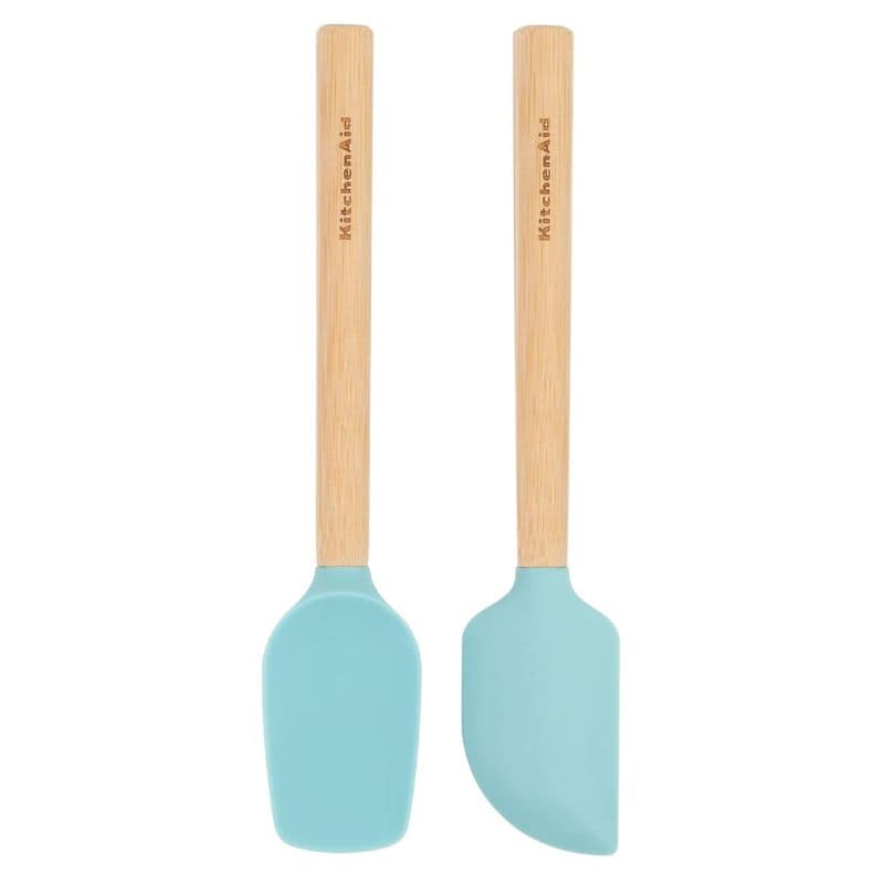 2 wood handled blue spatulas on a white background.