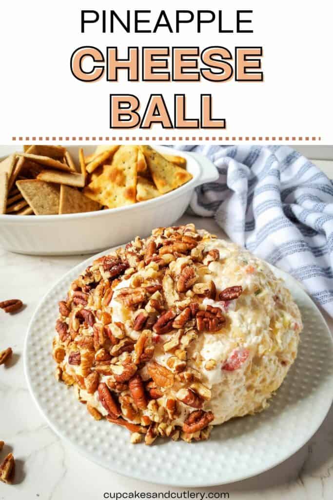 Text: Pineapple Cheese Ball. Pineapple cheese ball with pecans with a bowl of crackers for dipping.