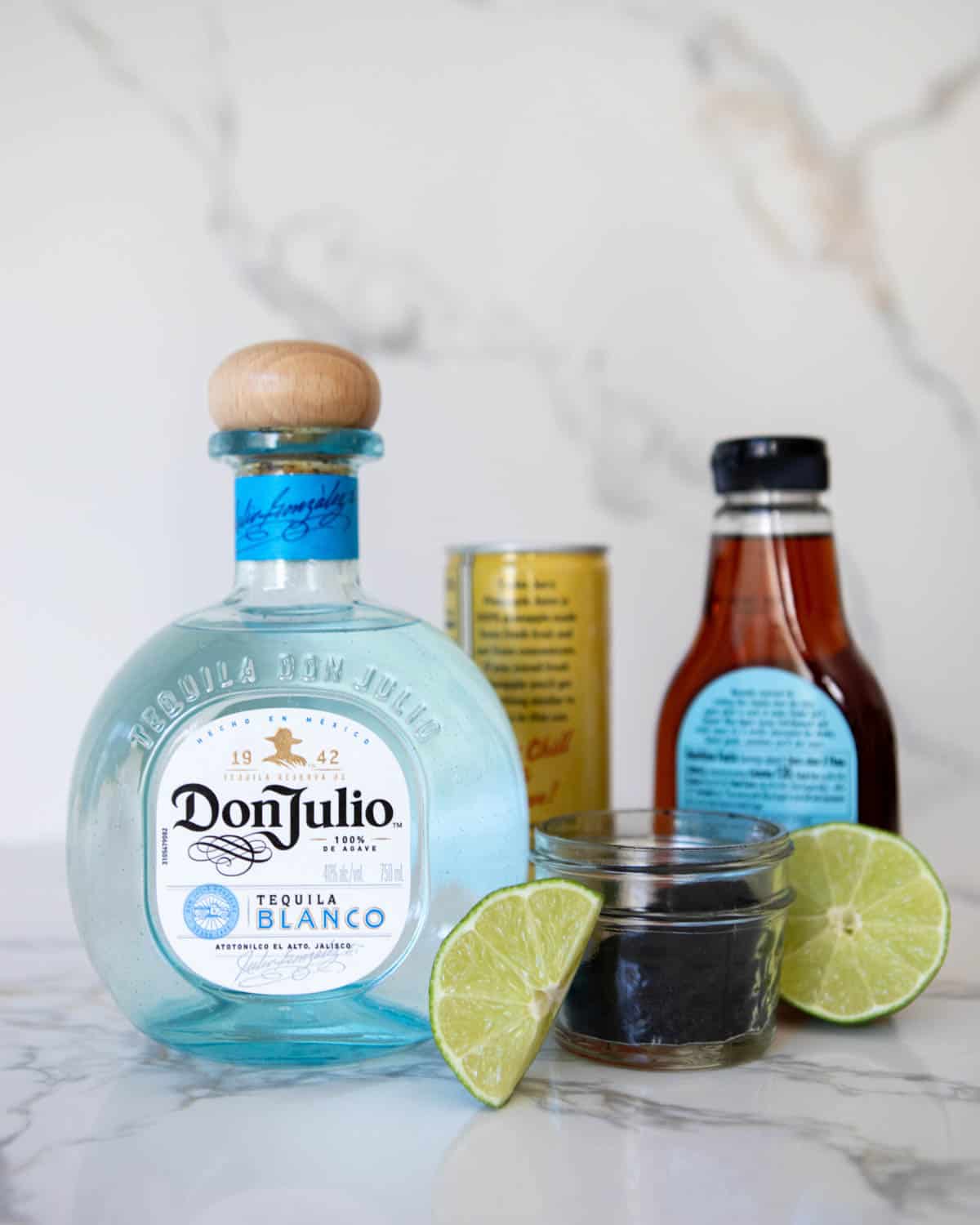 Ingredients to make a Halloween tequila drink on a counter. 