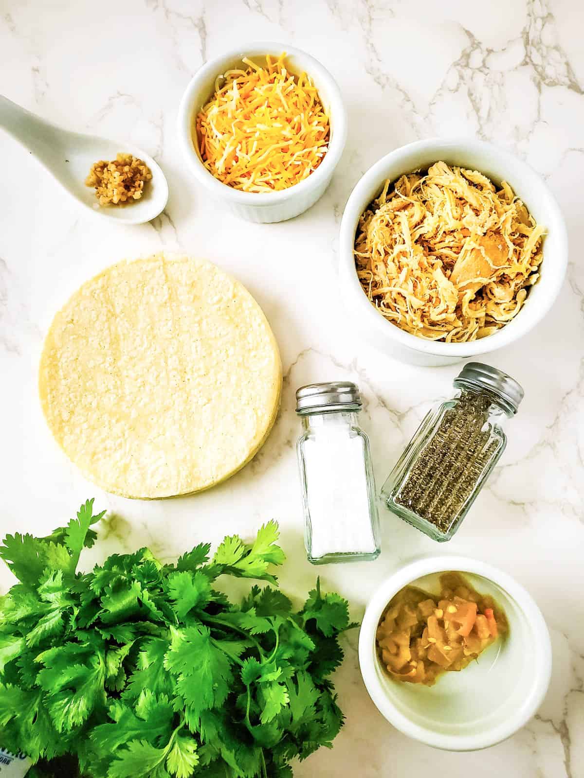Ingredients for making air fryer chicken taquitos with corn tortillas.