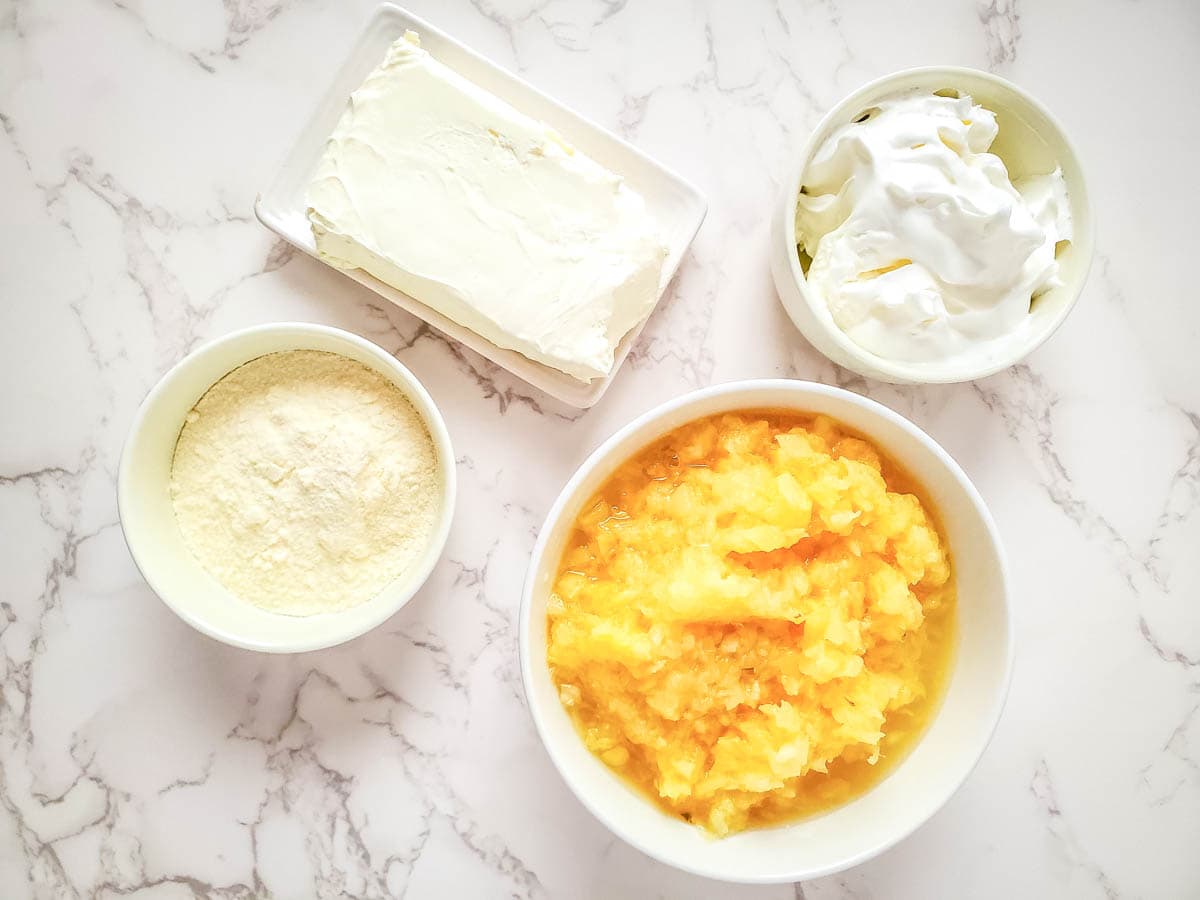 Four ingredients needed to make pineapple cream cheese dip.
