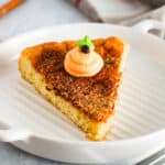 A close up of a slice of Snickerdoodle cookie cake on a white plate.