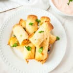 Chicken taquitos with corn tortillas cooked in an air fryer.