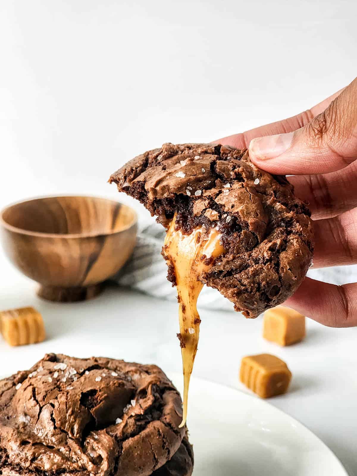 Delicious brownie cookies with gooey caramel topped with flaky sea salt.