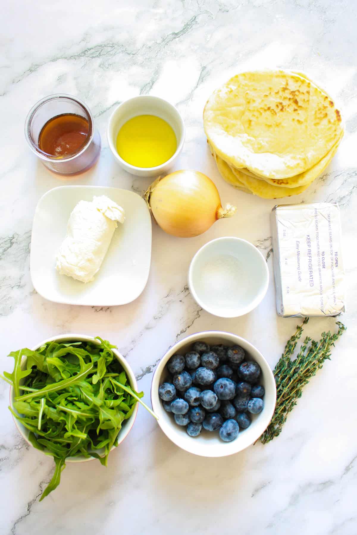 Ingredients needed to make goat cheese flatbread.