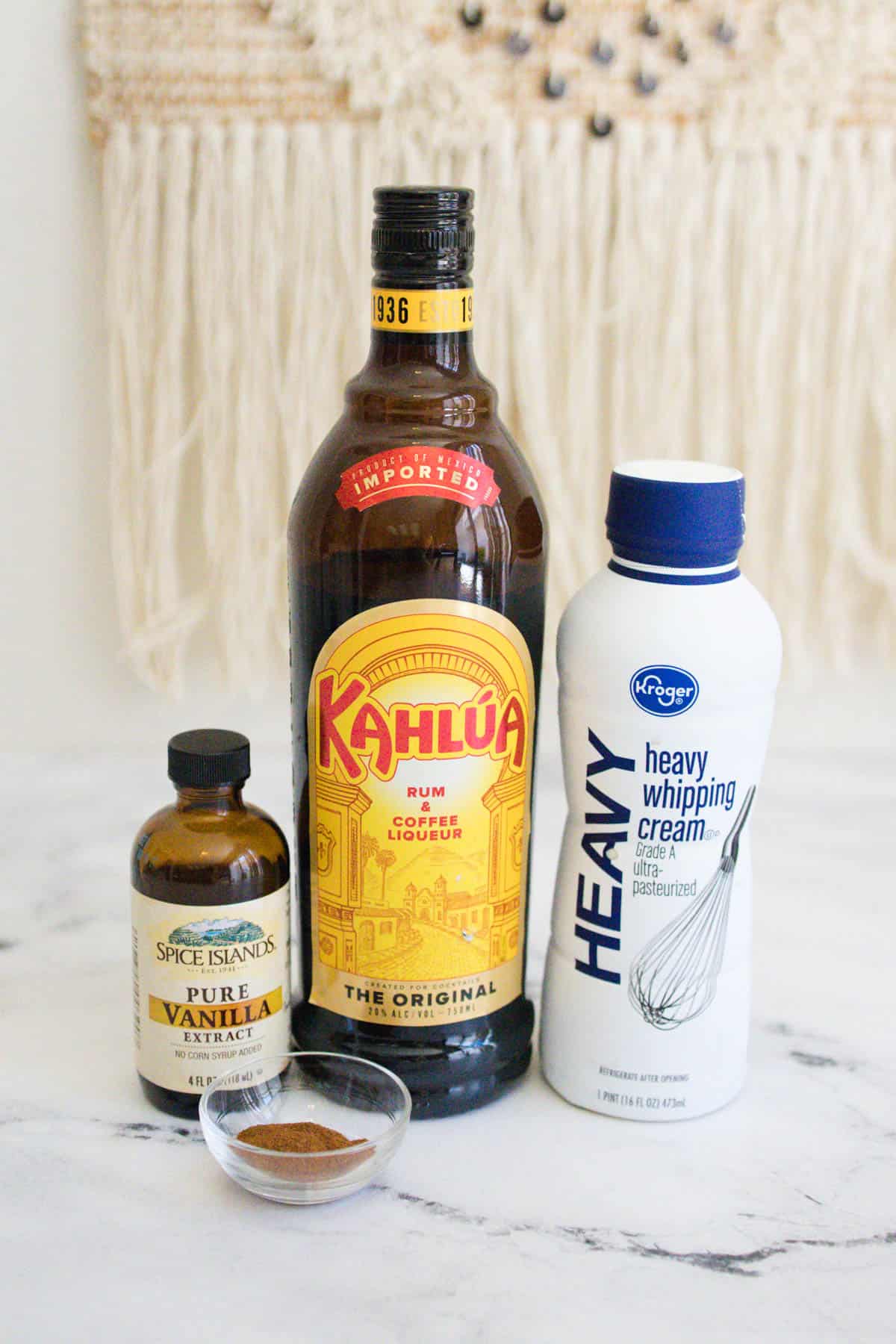 Kahlua and Cream ingredients on a marble countertop. 