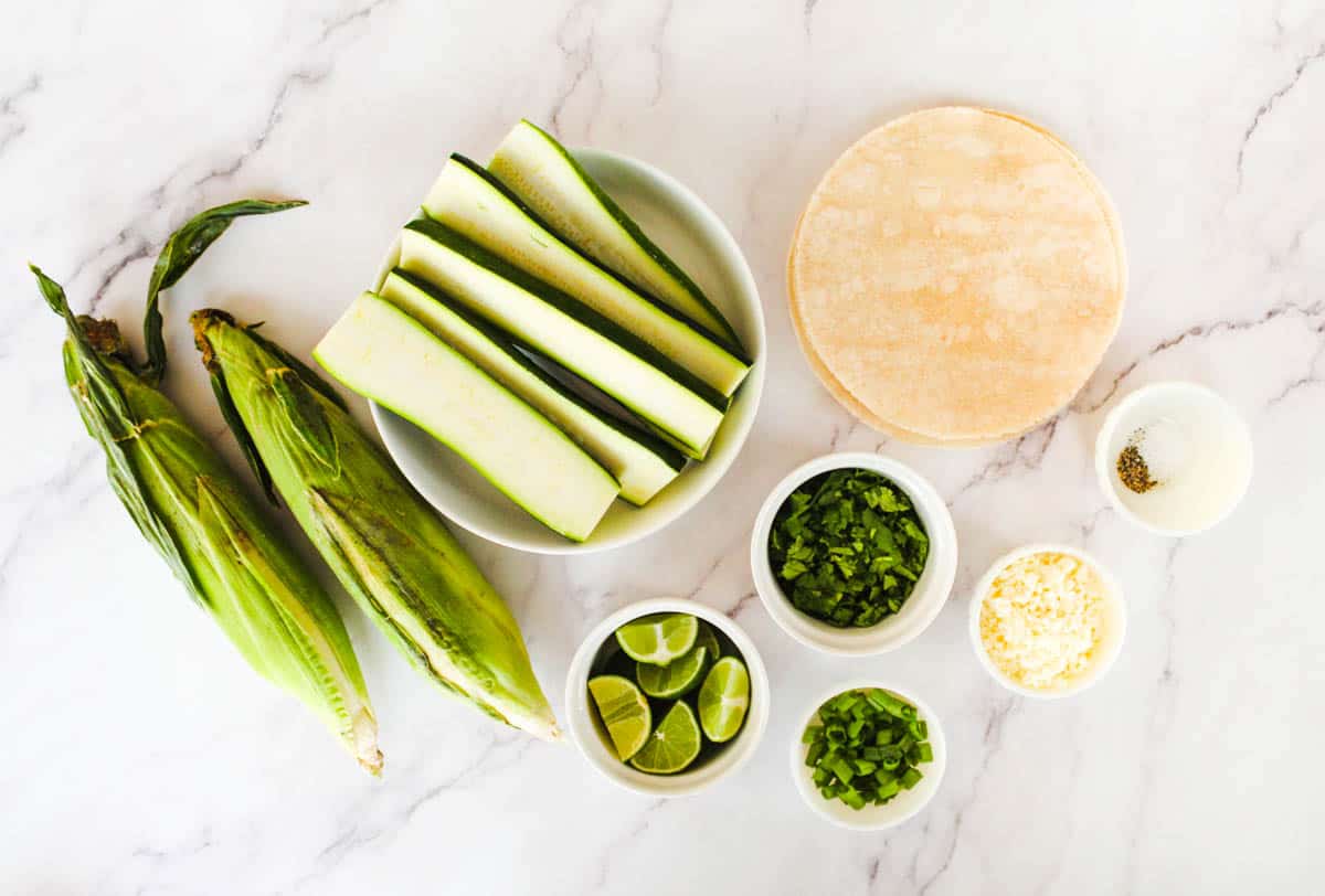 Ingredients needed to make zucchini corn tostadas.