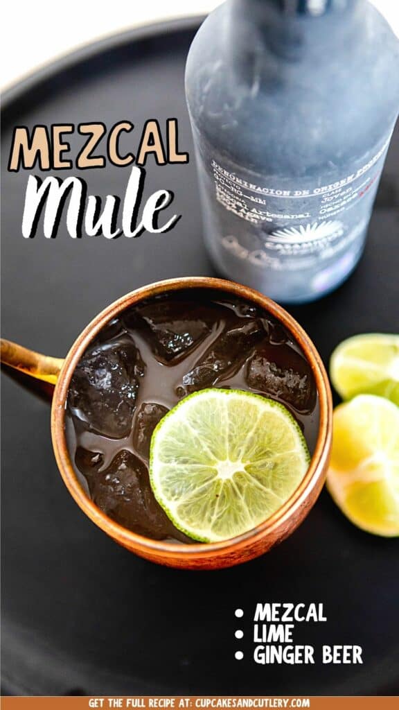 Overhead close up of a mezcal mule in a copper mug with ice and a lime wheel.