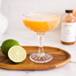 Close up of a pumpkin daiquiri in a coupe glass.