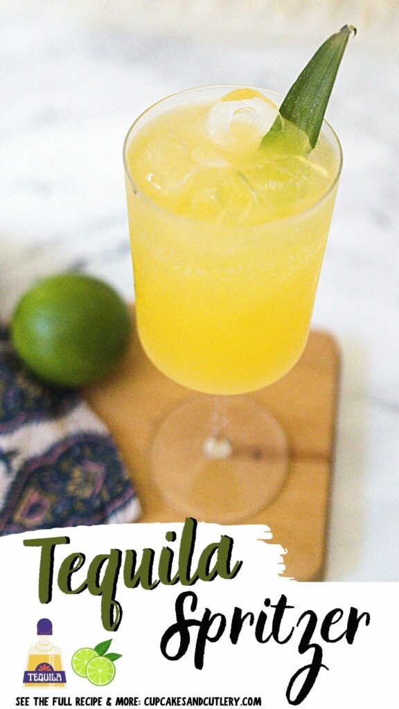 Close up of a tequila spritzer cocktail in a wine glass.