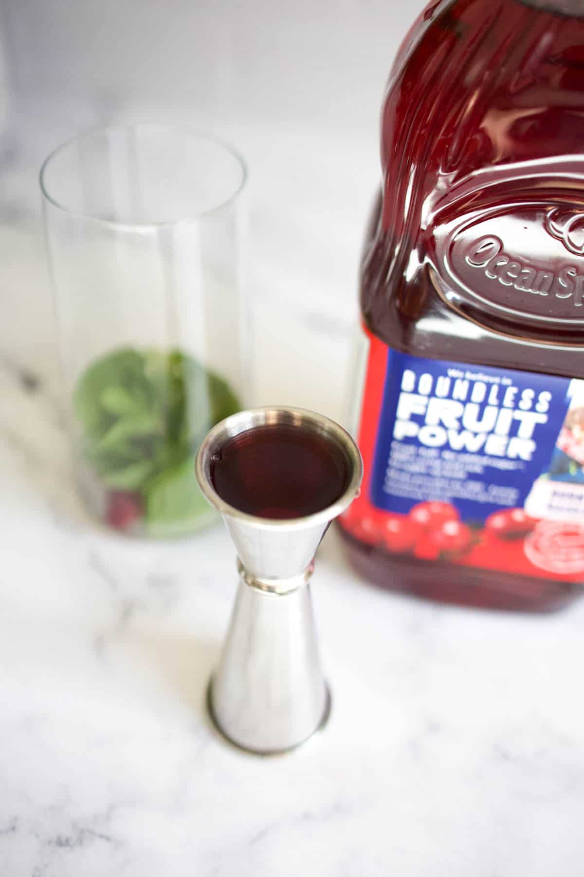 Jigger of cranberry juice Jigger of cranberry juice.