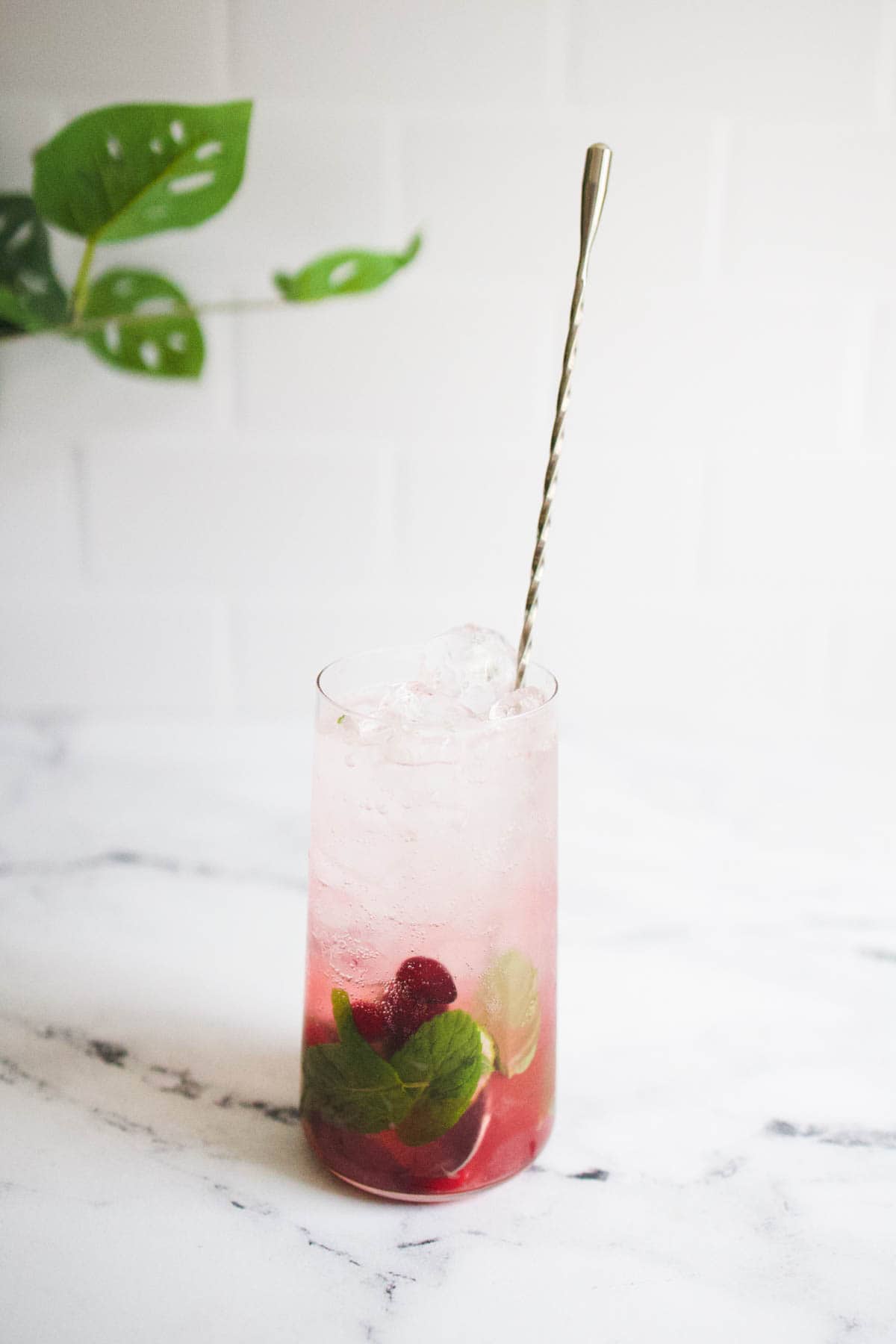 Cranberry mojito being stirred Cranberry mojito being stirred.