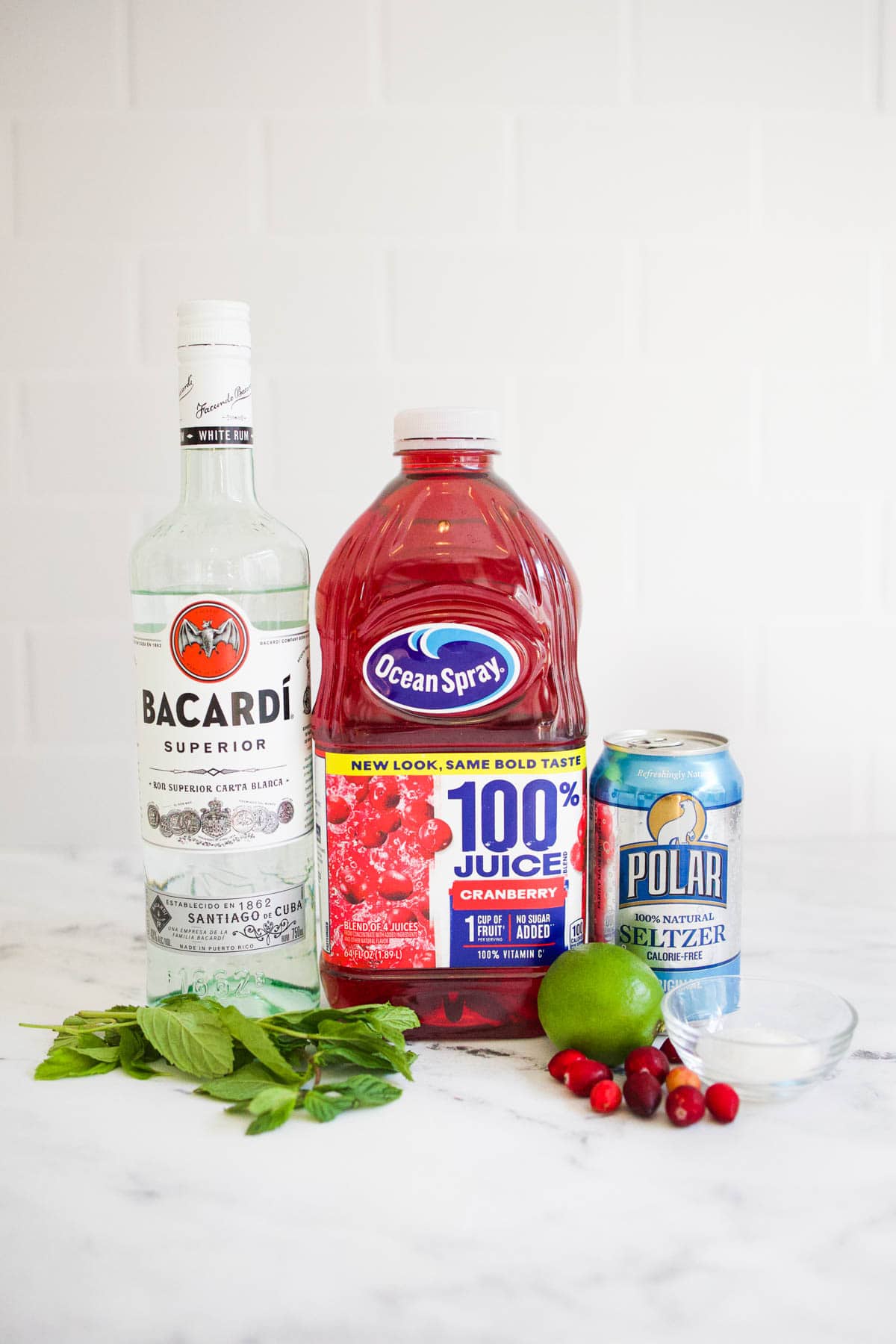 Cranberry Mojito ingredients Ingredients to make cranberry mojitos on the countertop.