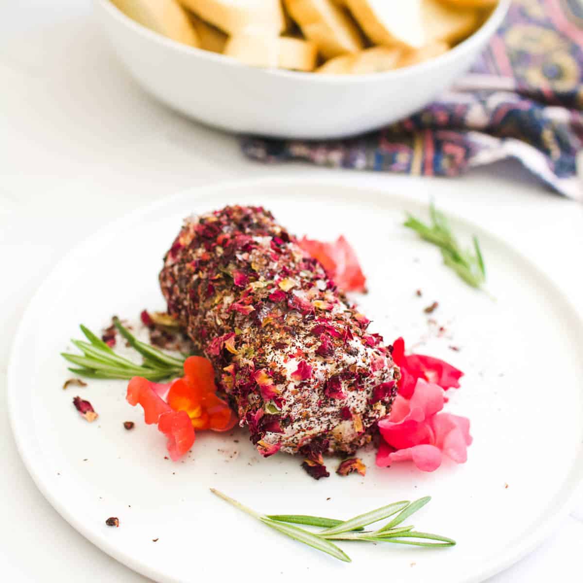 Rose petal and sumac crusted goat cheese log appetizer.