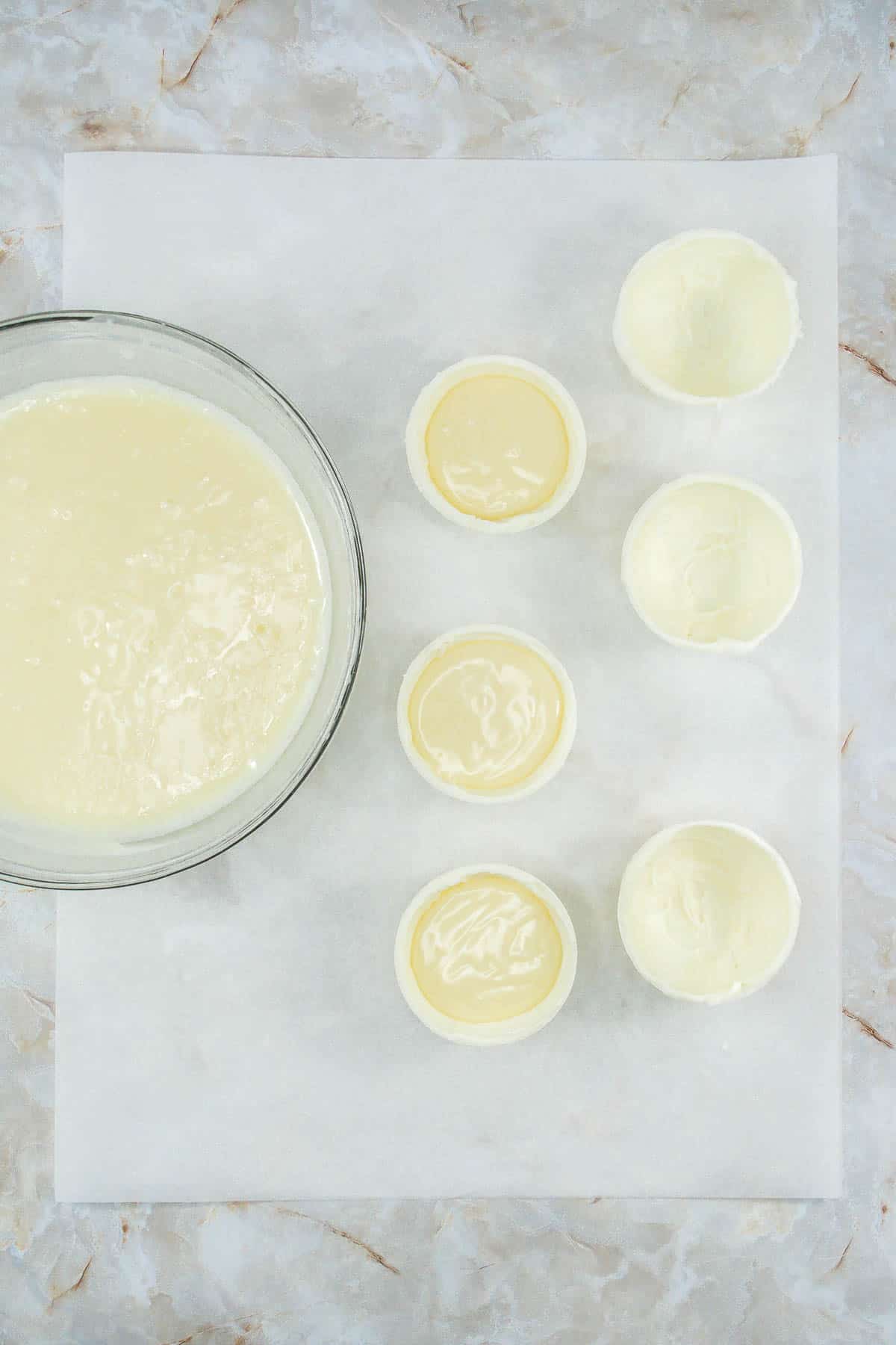 White chocolate half spheres filled with white chocolate ganache.