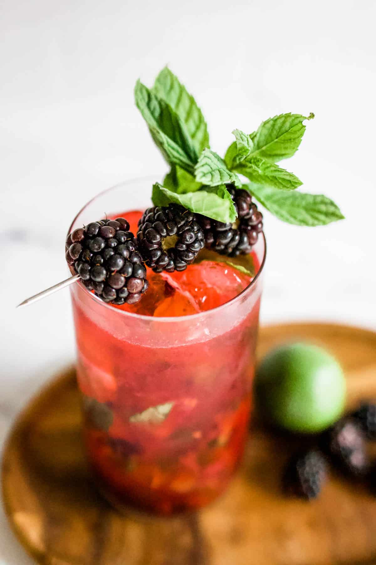 Blackberry Mojito Overhead shot of a blackberry mojito garnished with fresh mint and blackberries.
