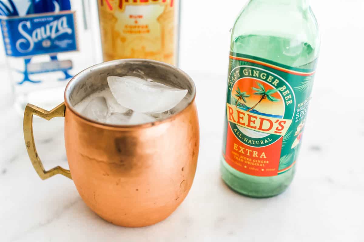 Mexican Mule next to a bottle of ginger beer.
