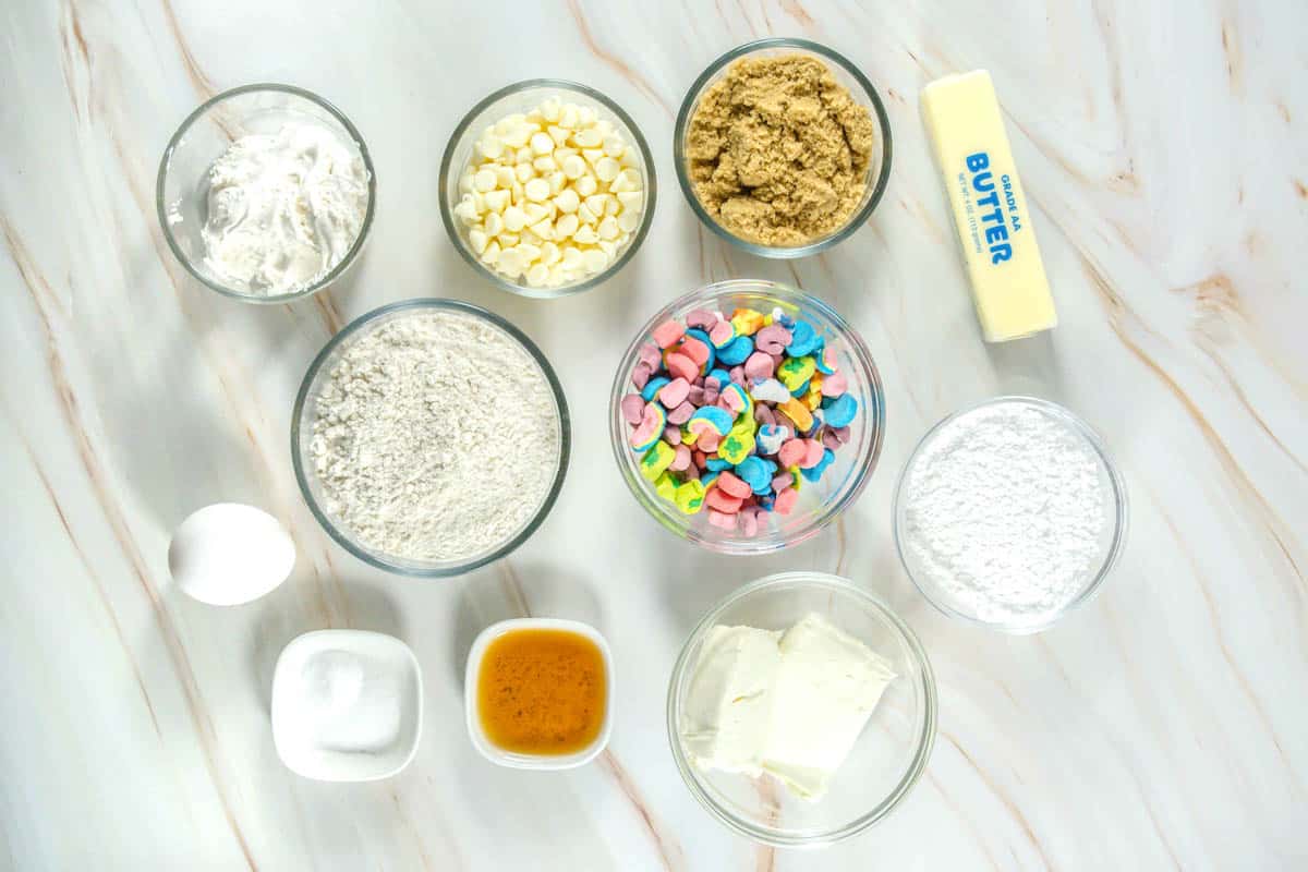 Lucky Charms Cookies recipe ingredients on a marble countertop.